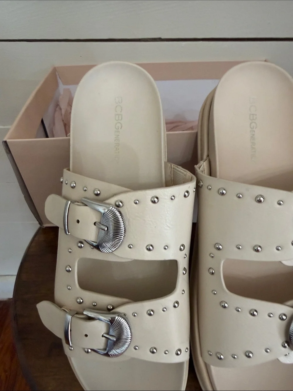 BCBGeneration Ivory Slide Sandals with Silver Buckles